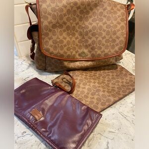 COACH Bag for baby. It comes with small bag and changing dippers sheet.